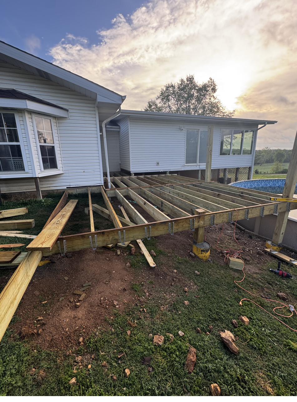 Deck construction framing at golden hour Southeast Missouri by Cheyenne Valley Construction